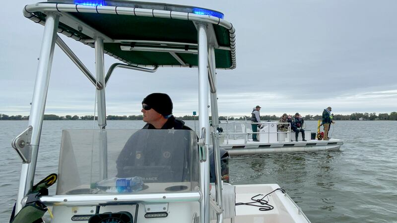 This photo released by the Polk County Sheriff's Office shows authorities searching for two...