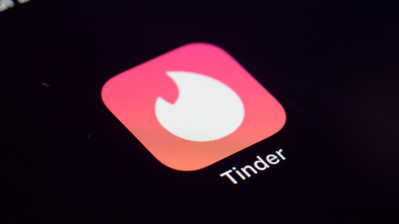 This Tuesday, July 28, 2020 photo shows the icon for the Tinder dating app on a device in New...
