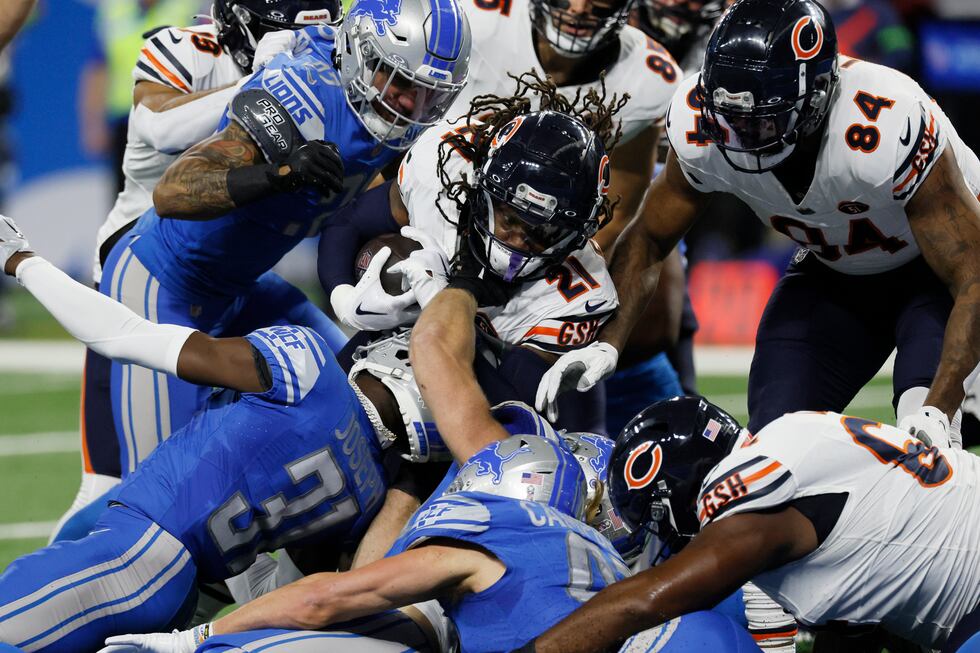 Chicago Bears running back D'Onta Foreman (21) is tackled during the first half of an NFL...